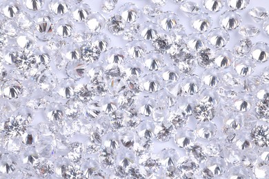 Many beautiful shiny diamonds as background, above view