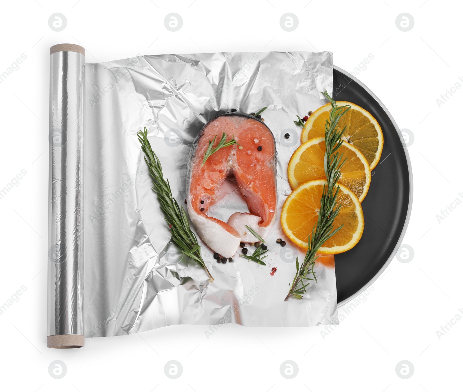 Photo of Aluminum foil with raw salmon, orange slices, rosemary and spices isolated on white, top view