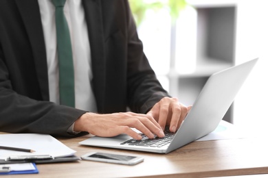 Consultant working at table in office