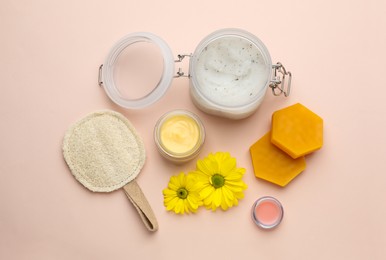 Photo of Flat lay composition with beeswax and cosmetic products on beige background