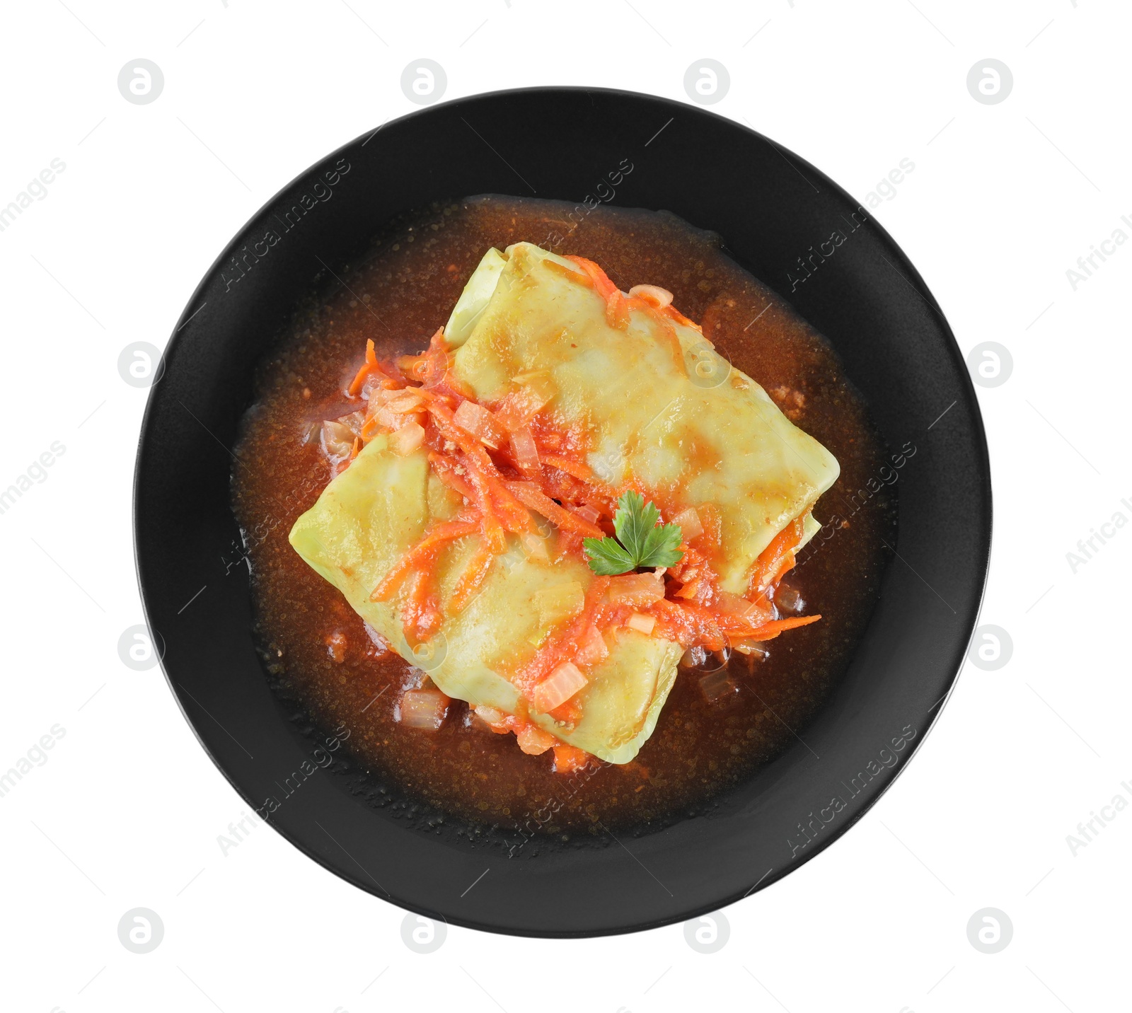 Photo of Delicious cabbage rolls with sauce isolated on white, top view