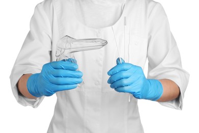 Photo of Doctor holding disposable vaginal speculum and gynecological examination kit on white background, closeup