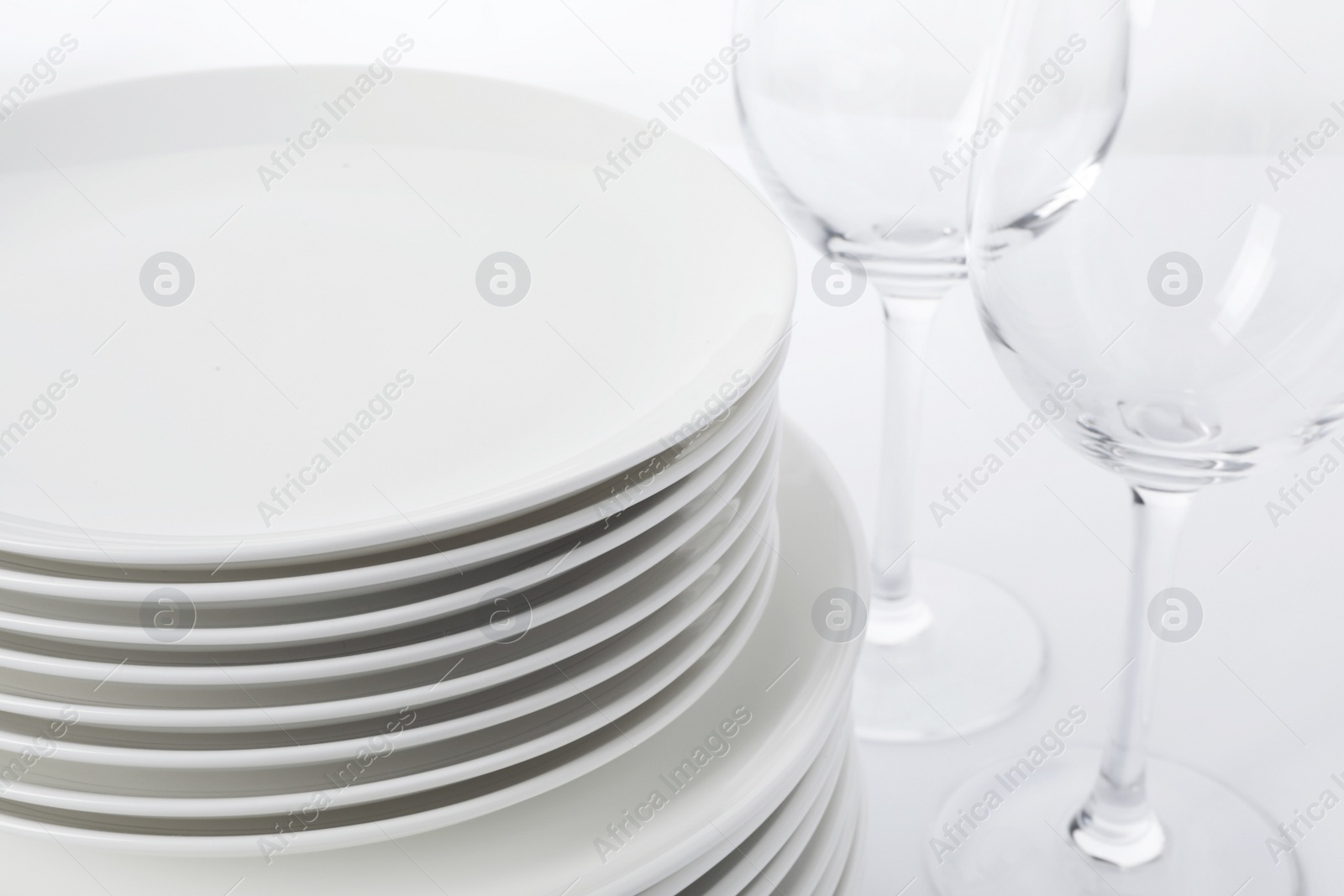 Photo of Set of clean tableware on white background, closeup. Washing dishes