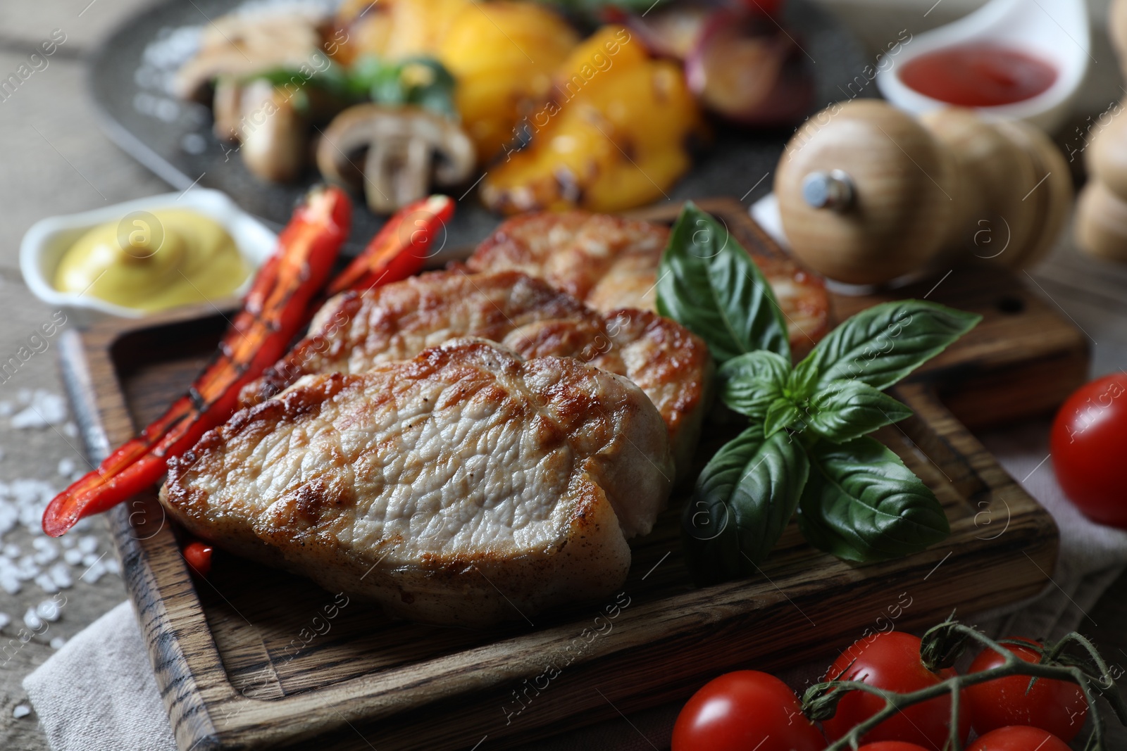 Photo of Delicious grilled meat and vegetables on table, closeup