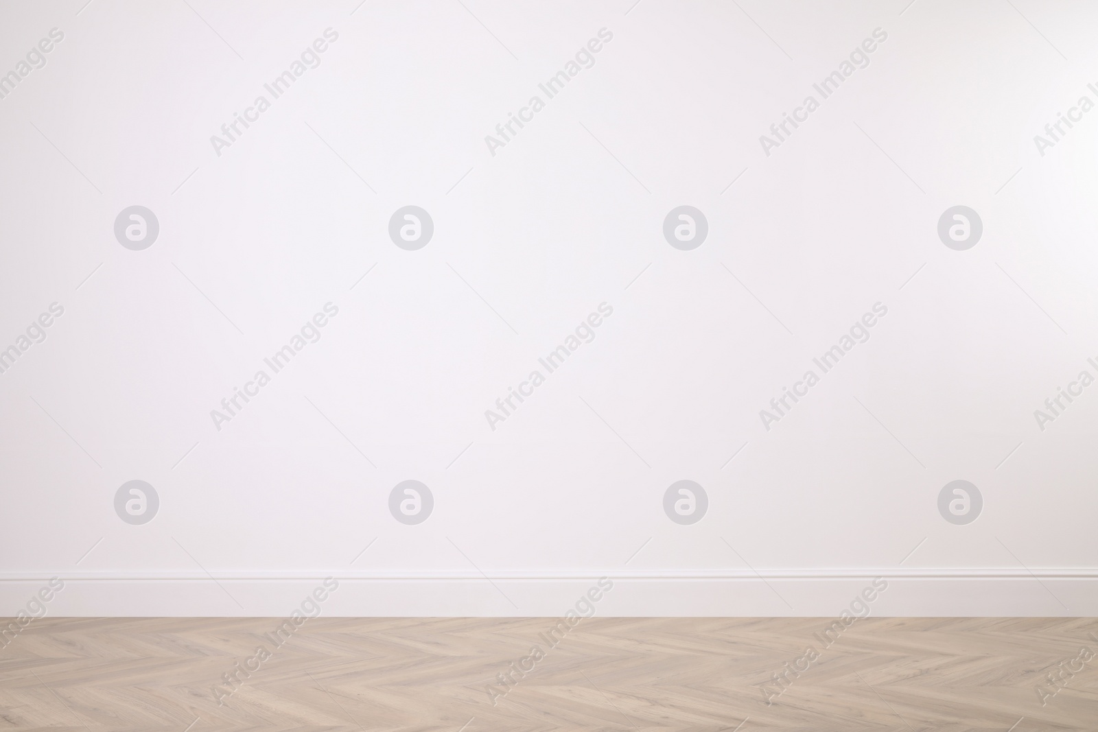 Photo of Blank white wall in room. Space for design