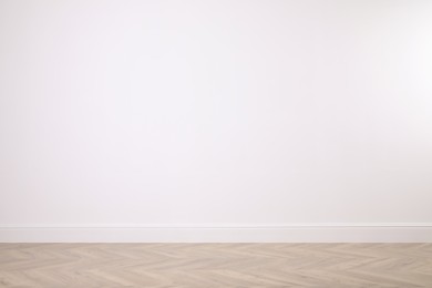 Photo of Blank white wall in room. Space for design