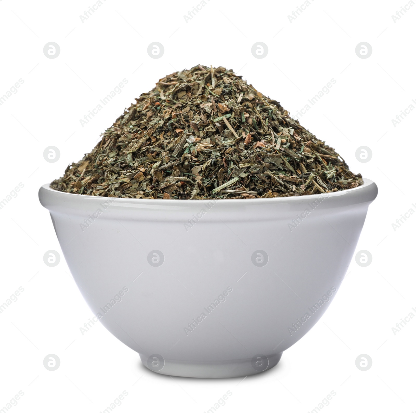 Photo of Bowl with dried parsley on white background