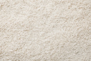 Raw basmati rice as background, top view