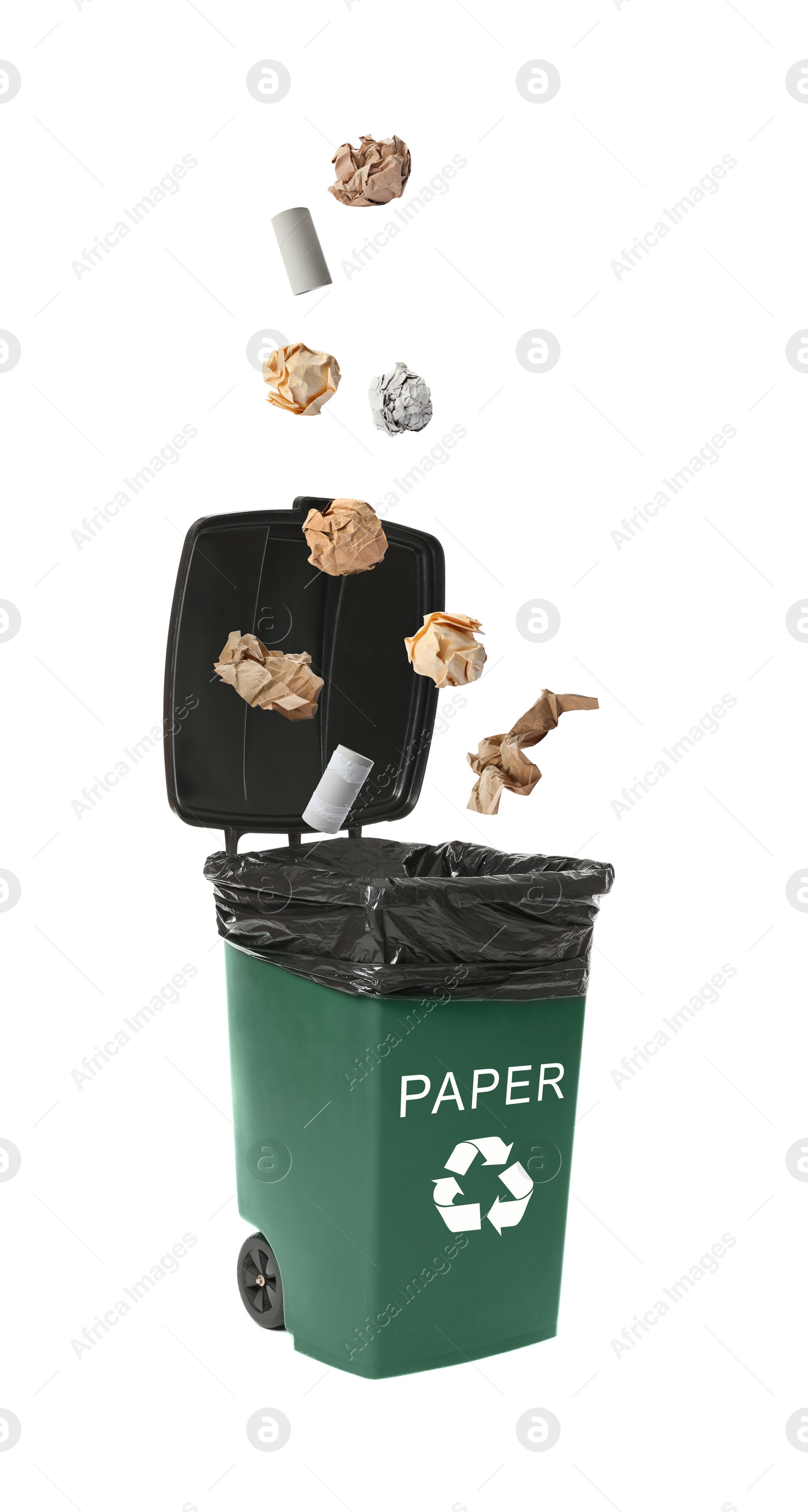 Image of Different paper garbage falling into trash bin. Waste management and recycling