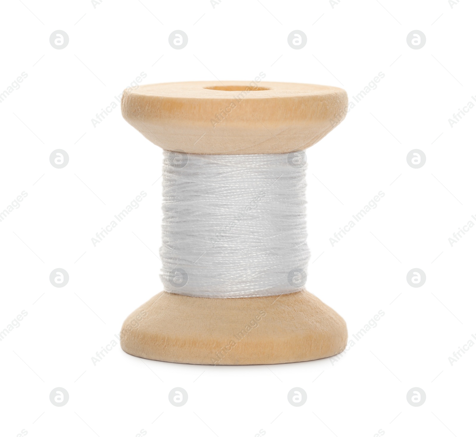 Photo of Wooden spool of sewing thread isolated on white