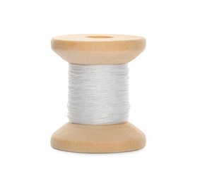 Photo of Wooden spool of sewing thread isolated on white