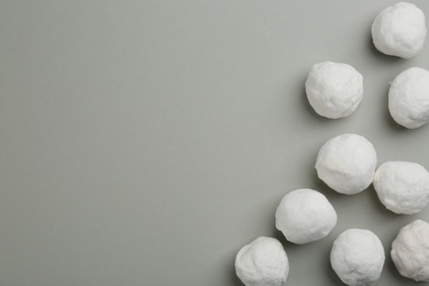 Photo of Snowballs on grey background, flat lay. Space for text
