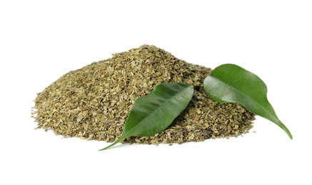 Photo of Pile of aromatic mate tea and fresh leaves on white background