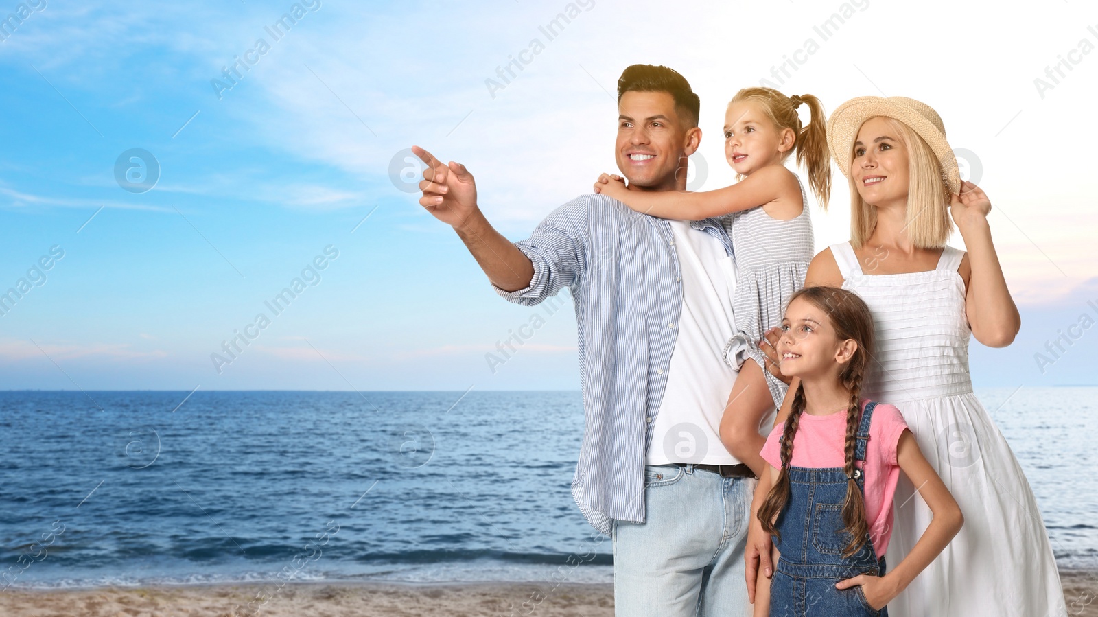 Image of Happy family on sandy beach near sea. Summer vacation