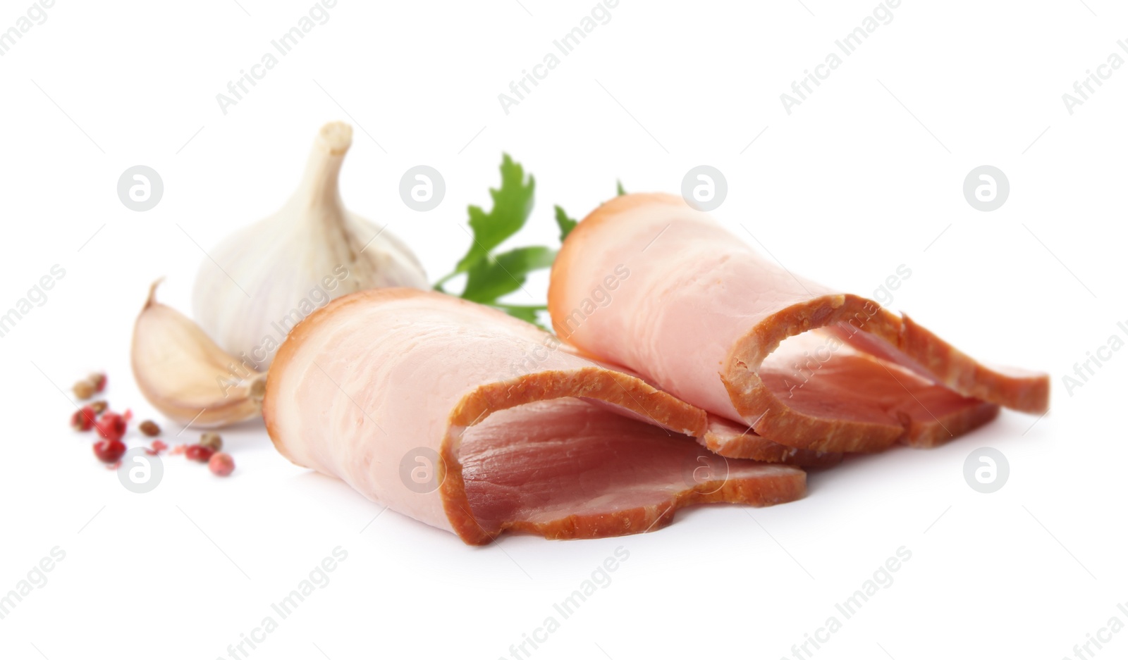 Photo of Slices of delicious smoked bacon with parsley, peppercorns and garlic on white background