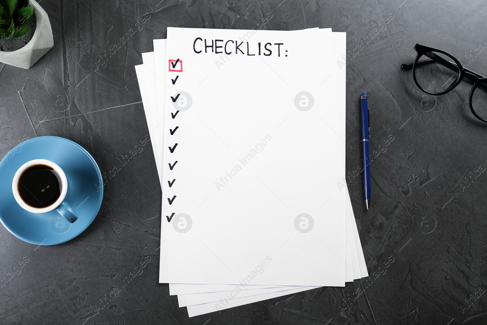 Photo of Paper sheet with inscription Checklist, cup of coffee and eyeglasses on dark grey table, flat lay