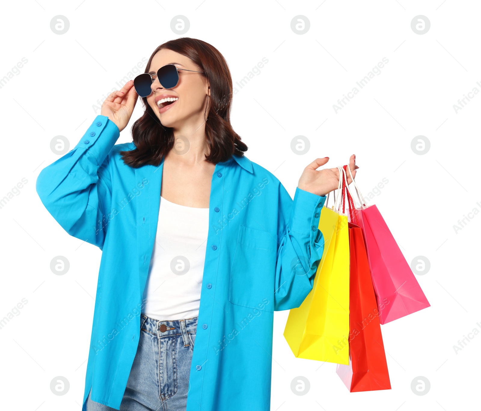 Photo of Beautiful young woman with paper shopping bags on white background