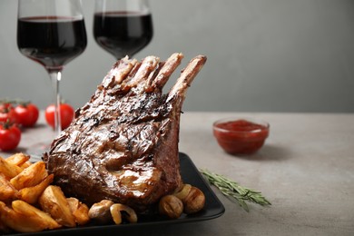 Delicious grilled ribs served on light grey table