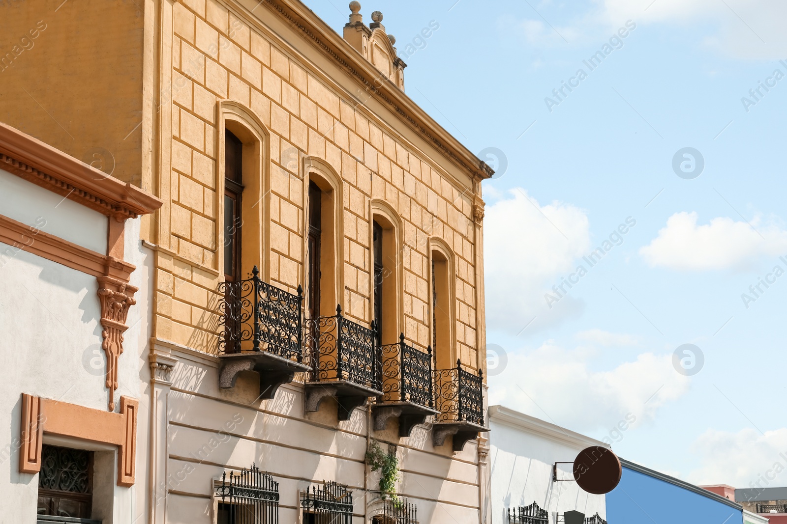 Photo of Exterior of beautiful building with windows and balconies