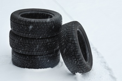 New winter tires on fresh snow outdoors