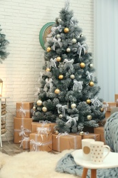 Decorated Christmas tree in modern living room interior