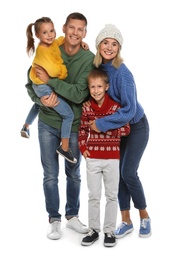 Photo of Happy family with children in warm sweaters on white background. Winter season