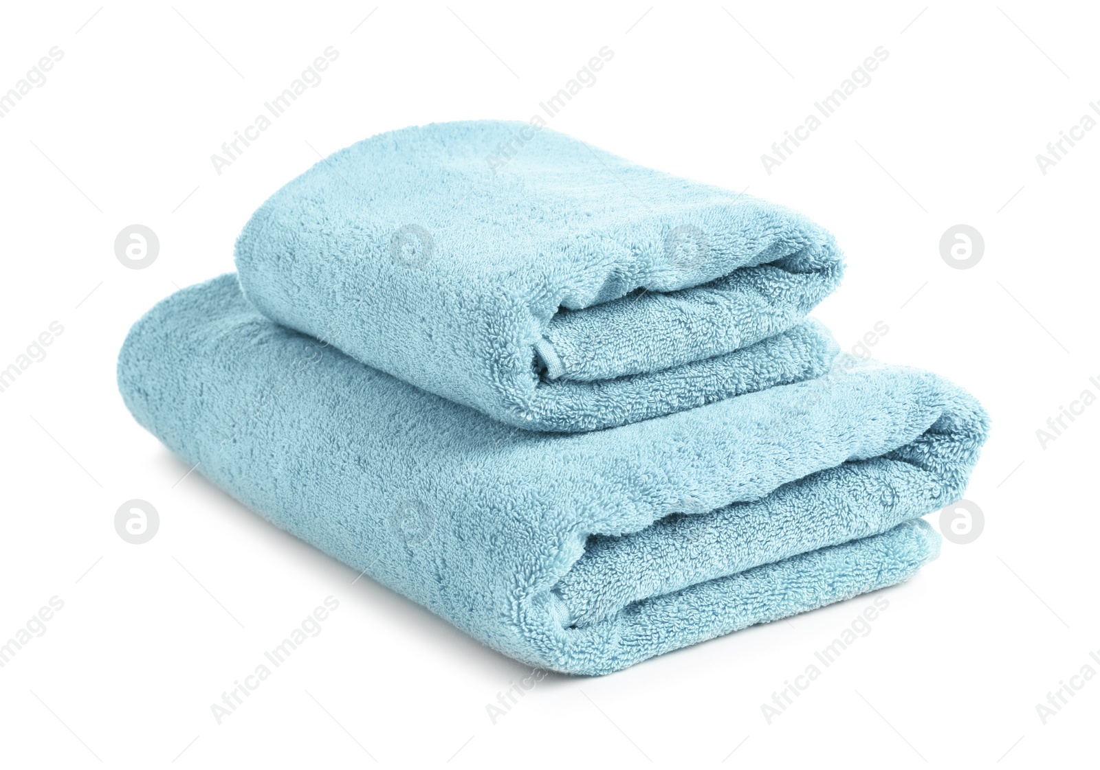 Photo of Folded clean soft towels on white background