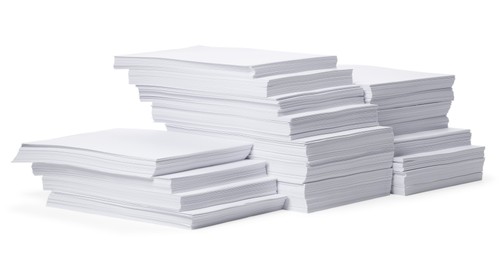 Photo of Stacks of paper sheets on white background