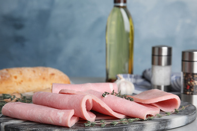 Tasty fresh ham on light grey table
