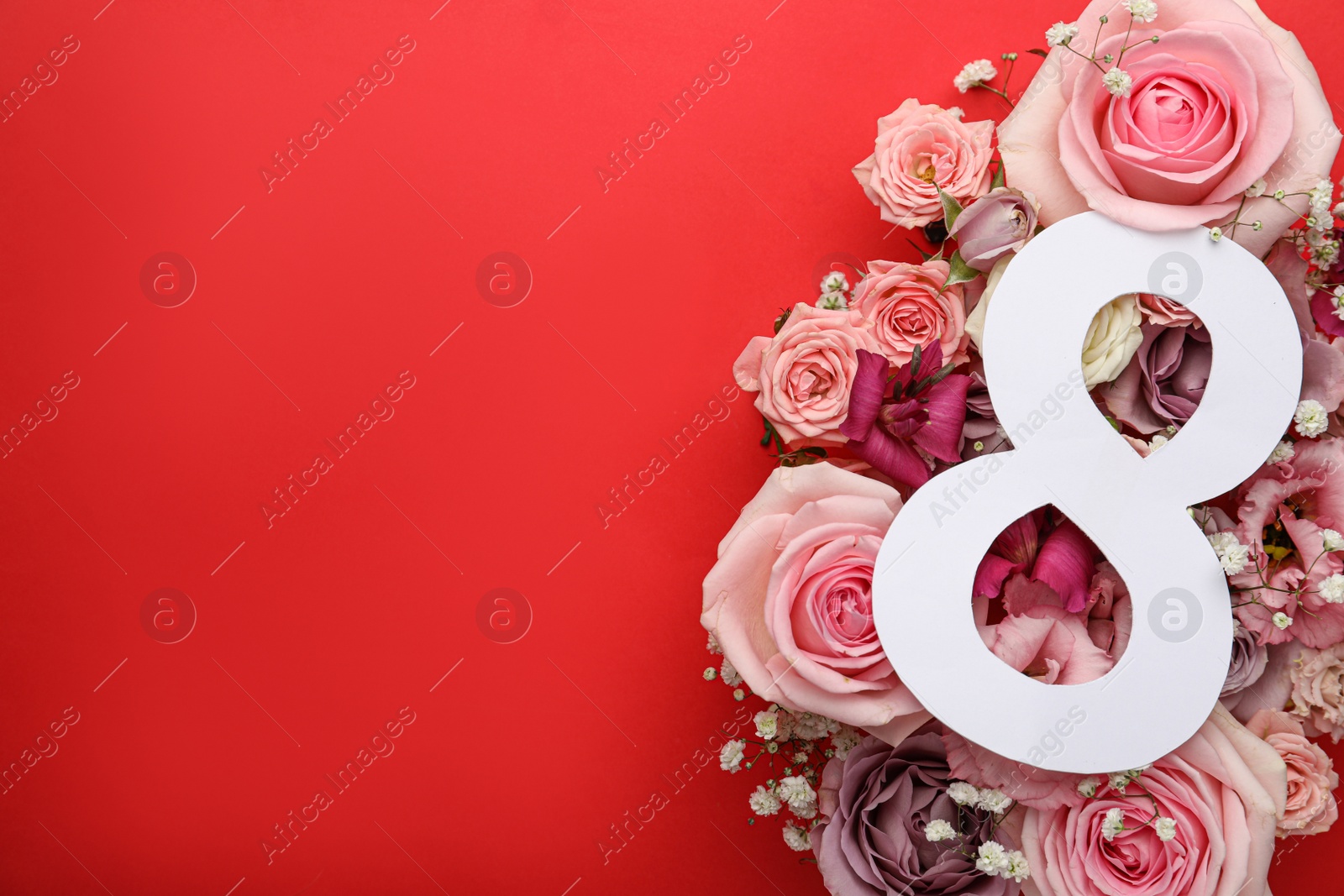 Photo of 8 March greeting card design with beautiful flowers on red background, space for text. International Women's day