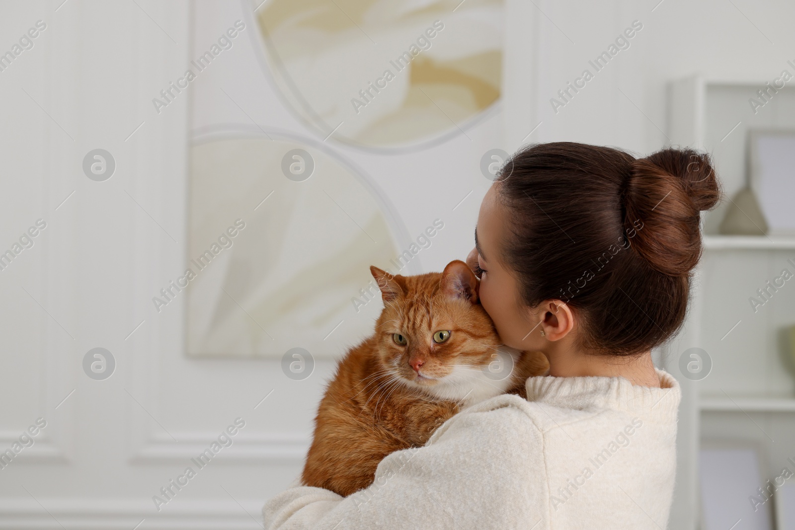 Photo of Woman with cute cat at home, space for text