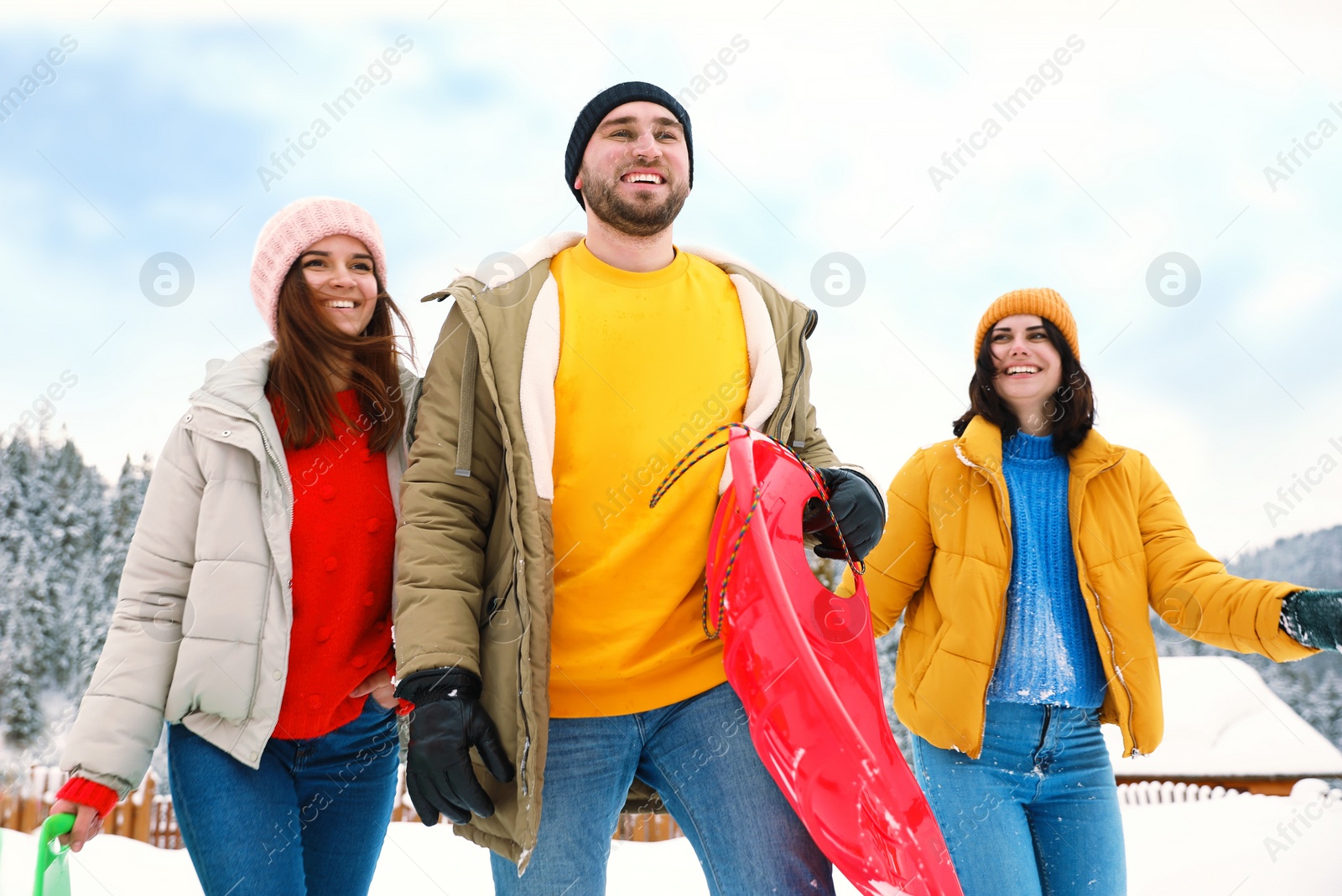 Photo of Group of friends outdoors on snowy day. Winter vacation