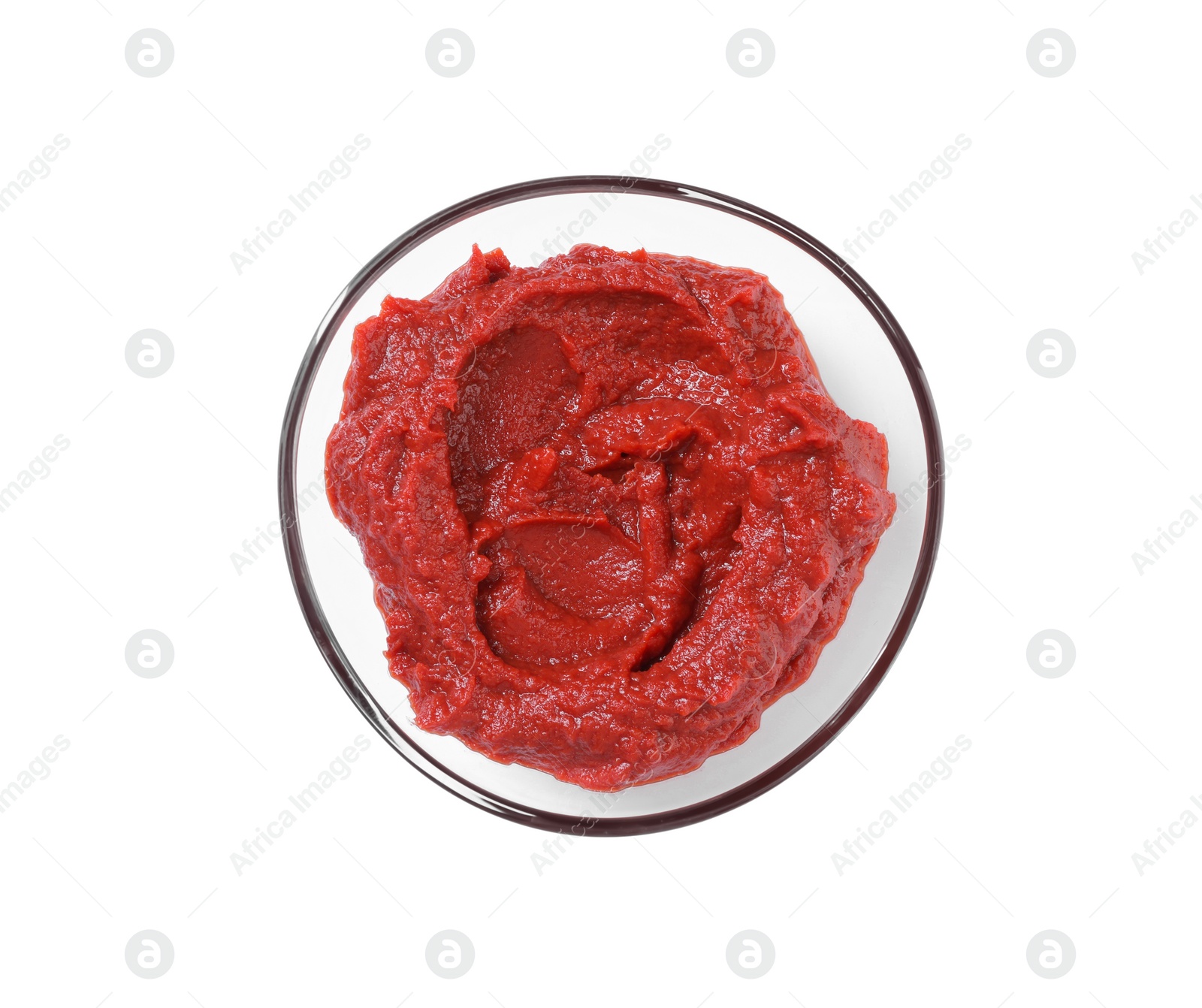 Photo of Glass bowl of tasty tomato paste isolated on white, top view
