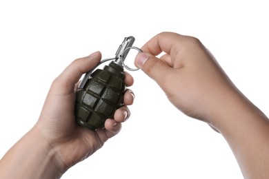 Photo of Man pulling safety pin out of hand grenade on white background, closeup