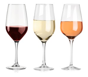 Image of Glasses of white, rose and red wine isolated on white