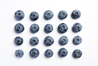 Flat lay composition with tasty blueberry on white background