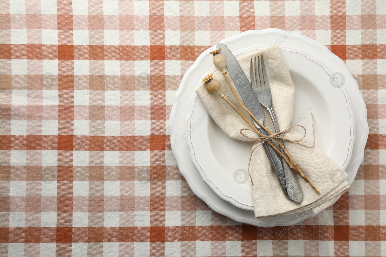 Photo of Stylish setting with cutlery and plates on table, top view. Space for text