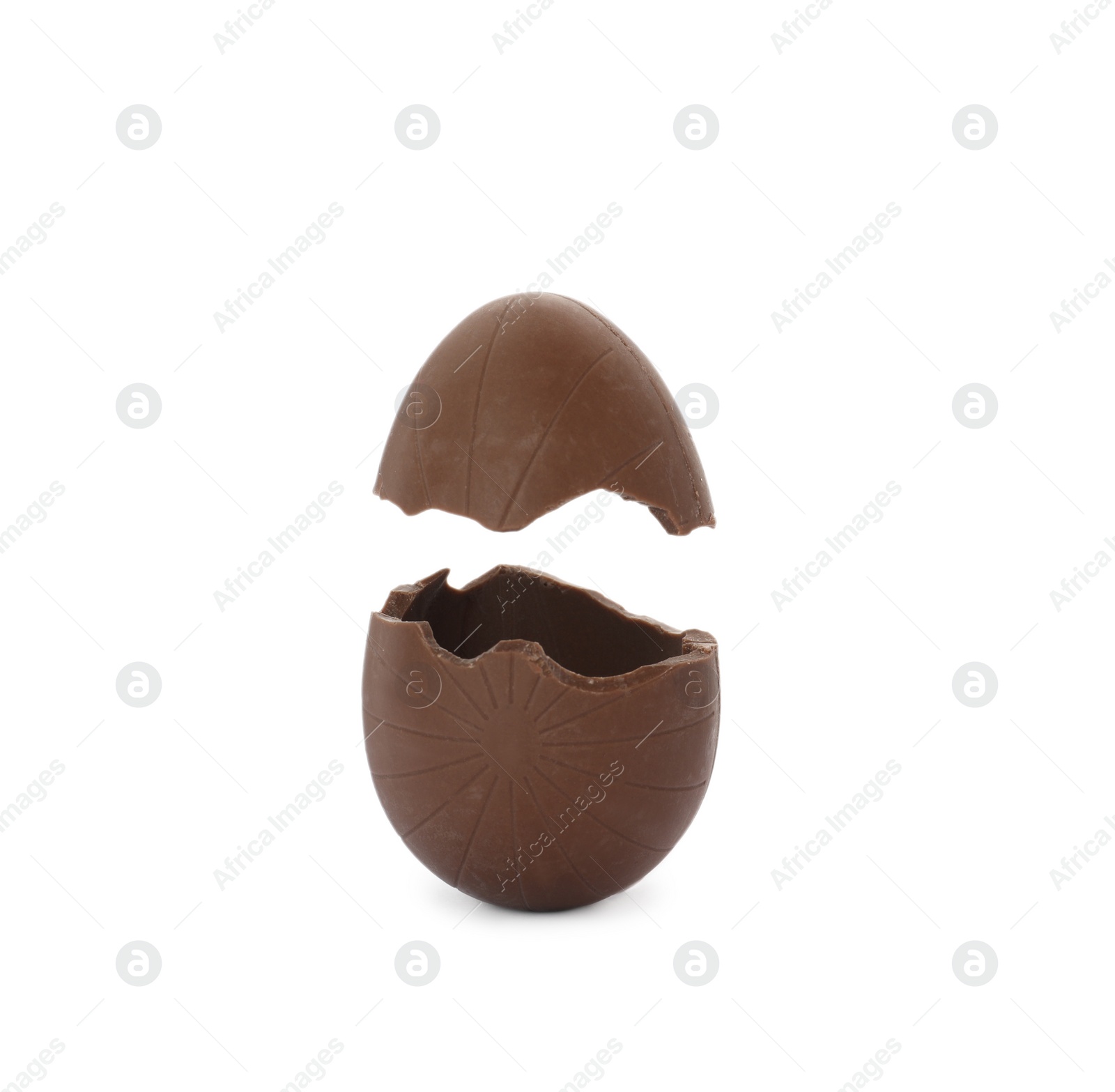 Photo of Broken milk chocolate egg on white background