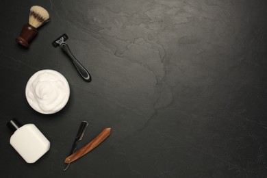 Photo of Set of men's shaving tools on black textured table, flat lay. Space for text