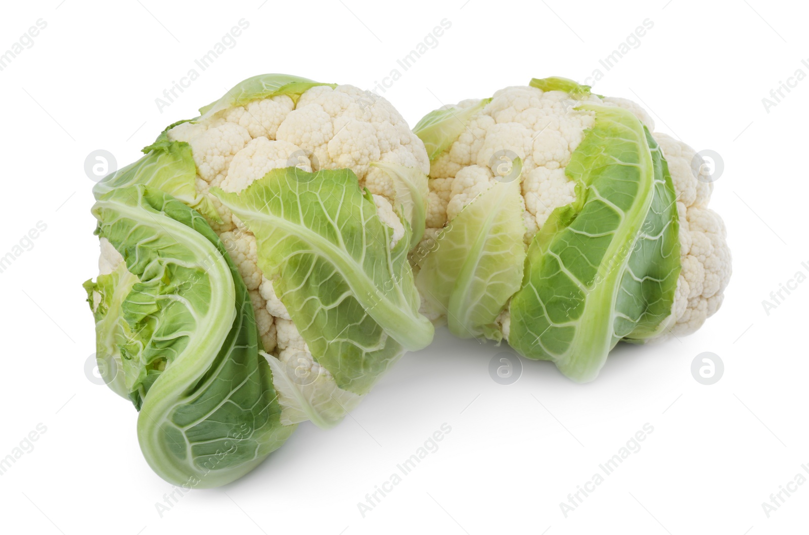 Photo of Whole fresh raw cauliflowers isolated on white