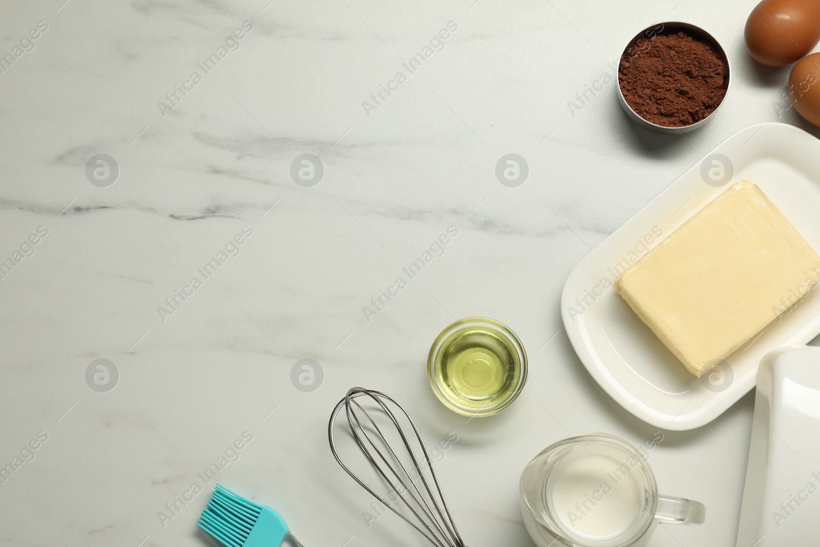 Photo of Flat lay composition with fresh butter among other products on white marble table. Space for text