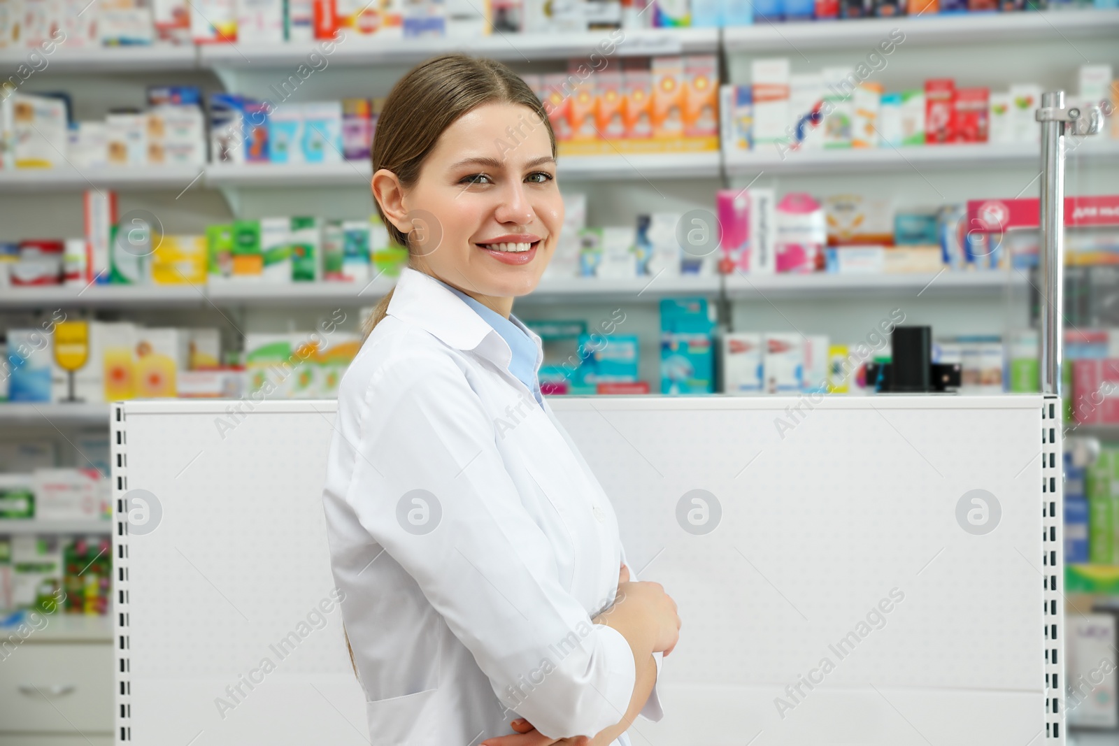 Photo of Portrait of professional pharmacist in modern drugstore