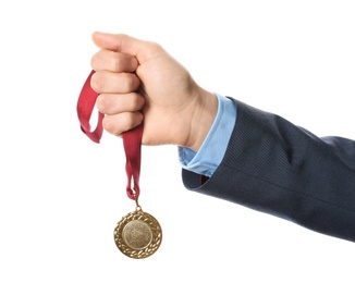 Photo of Man holding golden medal on white background, closeup