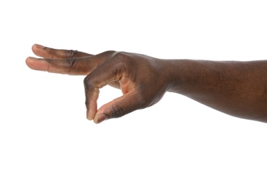 African-American man holding something in hand on white background, closeup