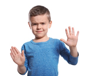 Photo of Little boy showing STOP gesture in sign language on white background
