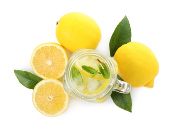 Photo of Cool freshly made lemonade and ingredients on white background, top view