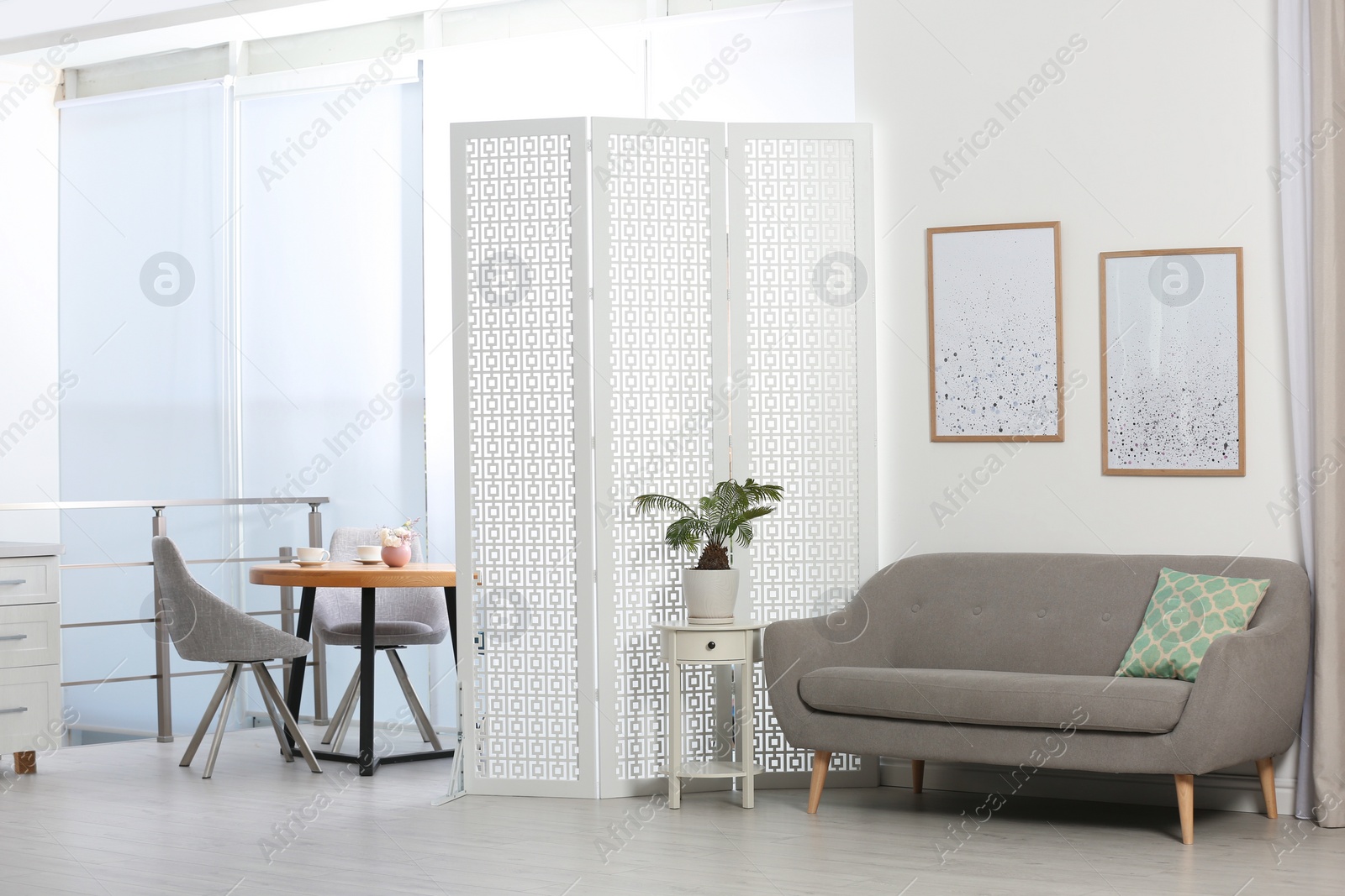 Photo of Modern folding screen in stylish room interior