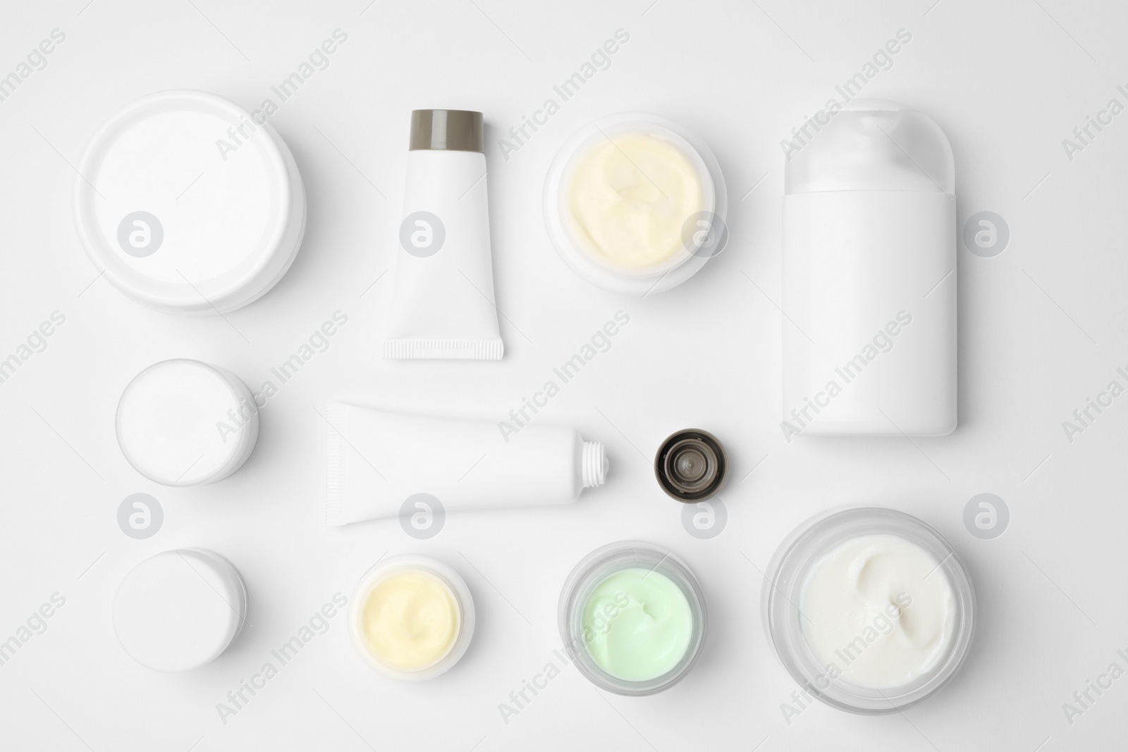 Photo of Flat lay composition with cosmetic products on light background