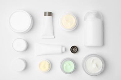 Flat lay composition with cosmetic products on light background