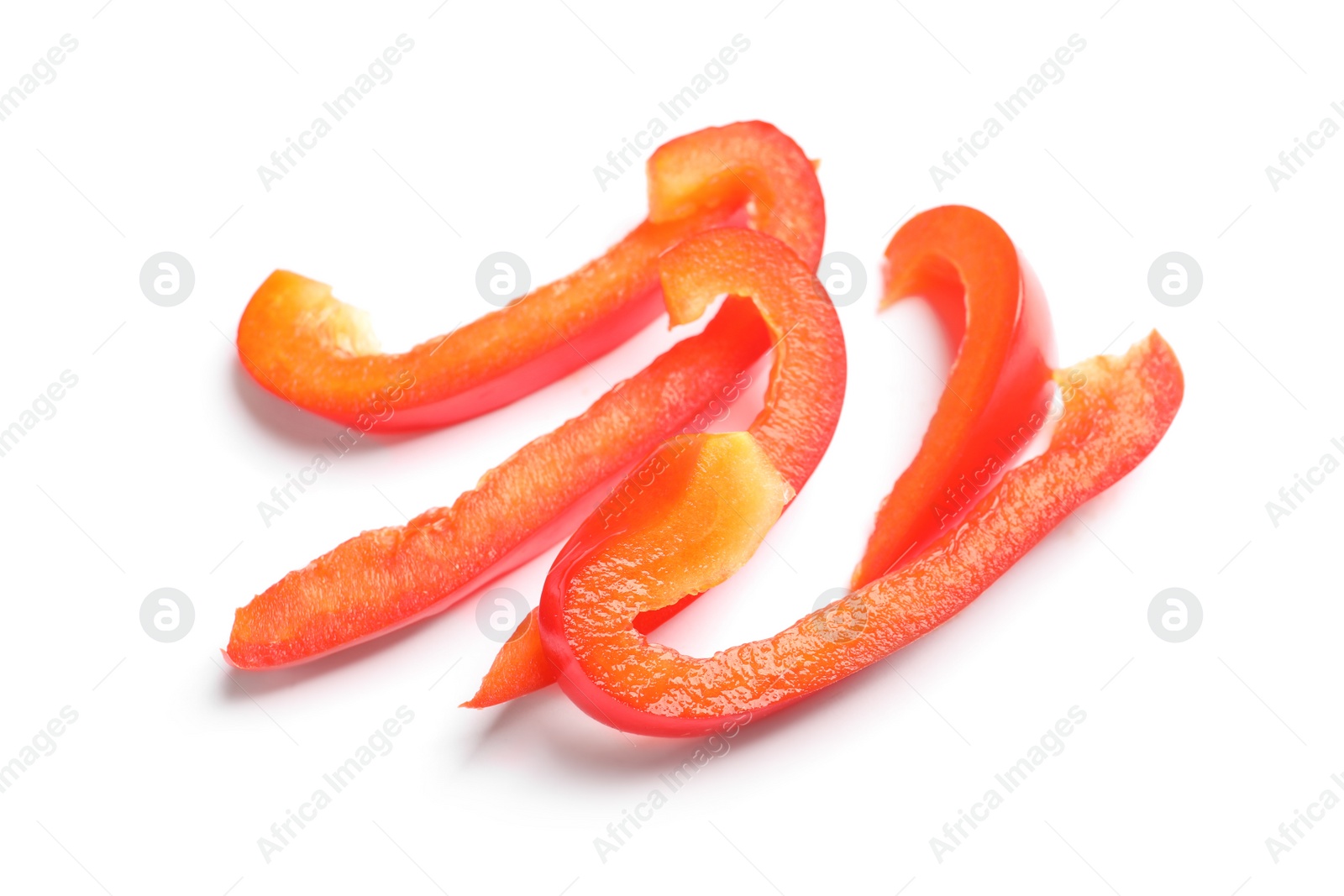 Photo of Slices of ripe red bell pepper on white background